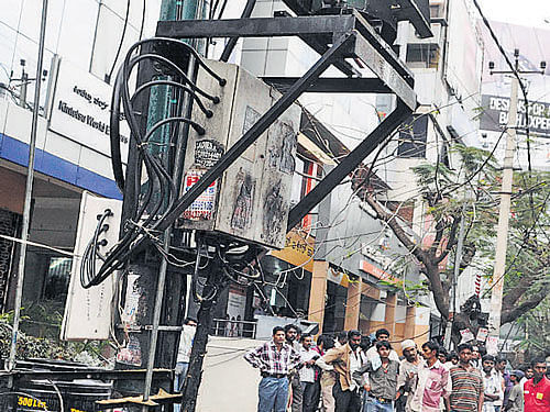 An electric transformer which exploded, causing injuries to three passersby, at Koramangala 4th Block on Saturday. DH Photo