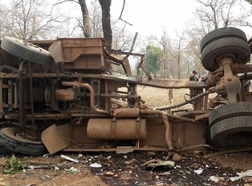 The vehicle damaged by a blast targetting a polling party in Bijapur district of Chhattisgarh on Saturday. Maoist rebels few people in two poll-related blasts in an insurgency-hit region of central India. PTI Photo