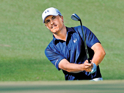 American Jordan Spieth chips to the tenth green during the third round of the Masters in Augusta on Saturday. AP Photo