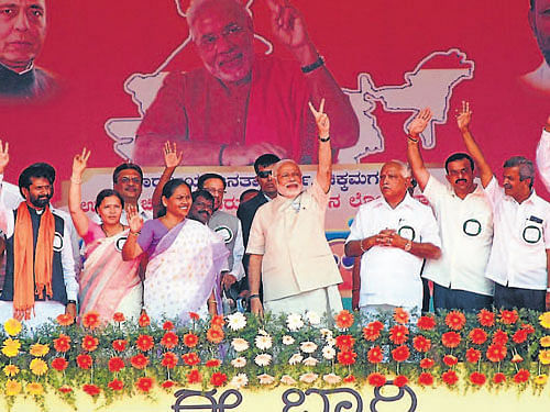 BJP prime ministerial candidate Narendra Modi addresses the party supporters at 'Bharatha Gellisi' rally at Subhashchandra Bose stadium in Chikmagalur on Sunday. DH Photo