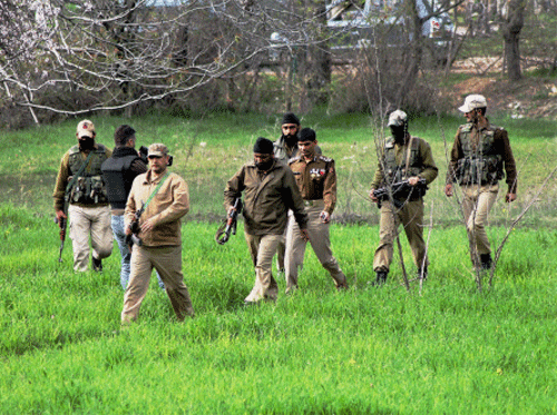 Security personnel arrive at an encounter site in South Kashmir's Khrew village in Pulwama district. PTI
