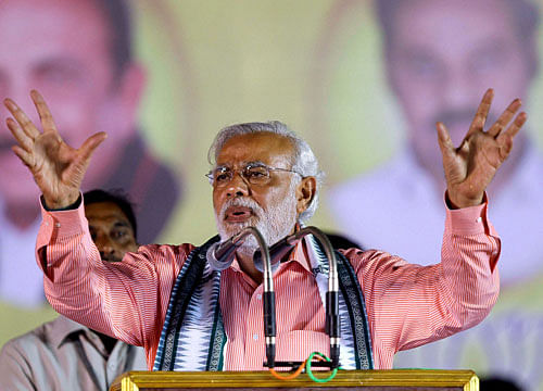On the 123rd birth anniversary of B R Ambedkar, Narendra Modi today attacked Rahul Gandhi saying he was ''insulting'' the chief architect of the Constitution by taking credit for enacting laws and giving rights to the people. PTI File Photo