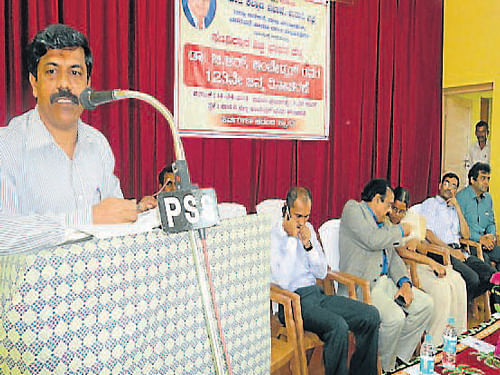 Academician Jayaprakash Shetty speaks at the 123rd birth anniversary celebrations of B R Ambedkar in Udupi. DH Photo