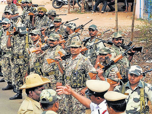 Security personnel stage  a flag march ahead of Lok  Sabha polls in Chikmagalur on Monday. KPN