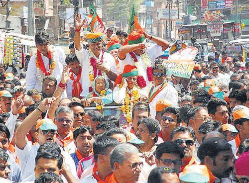 poll driven: BJP candidate Gajendra Singh with supporters at an election campaign rally in Jodhpur on Tuesday. pti