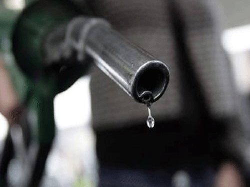 In the second reduction this month, petrol prices were again slashed by more than 70 paise per litre from Tuesday-Wednesday midnight. Petrol will now cost Rs 78.27 per litre in Bangalore, down 92 paise from the earlier Rs 79.19 per litre. PTI file photo