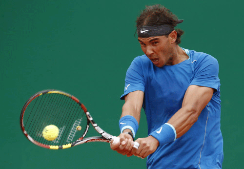 Rafael Nadal of Spain, returns the ball to Teymuraz Gabashvili of Russia during their match of the Monte Carlo Tennis Masters tournament in Monaco, Wednesday. AP photo