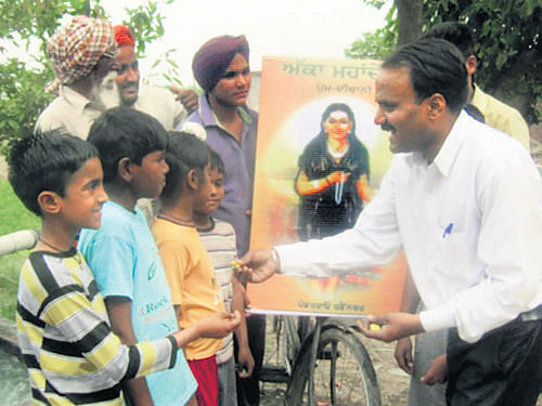 Panditrao Dharennavar cycles to villages in Punjab to spread the message of love and one religion. DHNS
