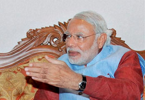 Sharpening his attack on P Chidambaram, BJP leader Narendra Modi today alleged wrist watches with photos of the Finance Minister were being distributed to voters and demanded a probe by the Election Commission. / PTI Photo