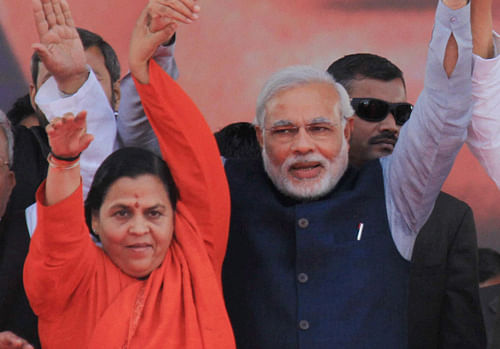 Mining out fresh ammunition for a prospective slugfest, Congress today released a three-year-old video clip in which senior party leader Uma Bharti has purportedly described Narendra Modi as an agent of destruction and his development claims of Gujarat as a 'sham' / PTI file photo