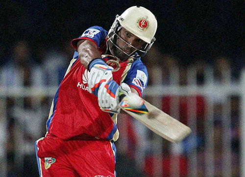 Yuvraj Singh of the Royal Challengers Bangalore during match 2 of the Pepsi Indian Premier League Season 7 between the Delhi Daredevils and The Royal Challengers Bangalore held at the Sharjah Cricket Stadium, Sharjah, United Arab Emirates on Thursday. A confident Royal Challengers Bangalore would look to carry on their winning momentum when they take on title holders Mumbai Indians, who would be low on belief after the opening thrashing in the Indian Premier League, here tomorrow. PTI Photo