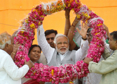 BJP's prime ministerial candidate Narendra Modi has expressed the hope that if he comes to power at the centre, he would get cooperation of Mamata Banerjee government in creating a conducive atmosphere for industrialisation in West Bengal including resolving the Singur problem. PTI photo