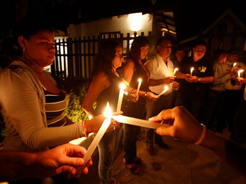 Residents light candles as they pay homage in front of the house of Colombian Nobel Prize laureate Gabriel Garcia Marquez in Aracataca April 17, 2014. Garcia Marquez, the Colombian author whose beguiling stories of love and longing brought Latin America to life for millions of readers and put magical realism on the literary map, died on Thursday. He was 87. Garcia Marquez died at his home in Mexico City, a source close to his family said. Known affectionately to friends and fans as 'Gabo', Garcia Marquez was Latin America's best-known author and most beloved author and his books have sold in the tens of millions. REUTERS