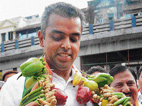 Congress candidate Milind Deora during a campaign in Mumbai on Friday. PTI