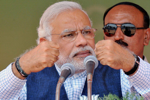 : BJP's PM candidate Narendra Modi addresses an election campaign rally in Erode on Thursday. PTI Photo
