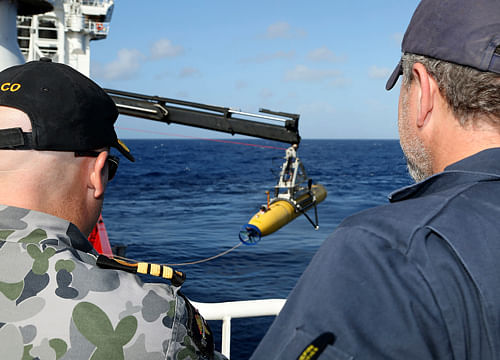 The underwater search for the crucial flight recorders of the crashed Malaysian jet could be completed within a week, Australian officials said as a robotic mini-submarine launched its eighth mission today with still no sign of wreckage or black box of the plane. / AP Photo