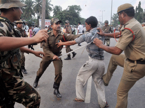 At least 20 people were injured when police used lathis to disperse a group of people who gheraoed the deputy commissioner's office here during a bandh today. PTI File Photo