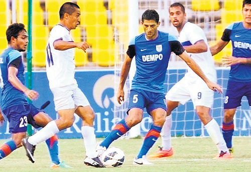 KICKING&#8200;OFF HISTORY: Bengaluru FC skipper Sunil Chhetri (second from left) in action during BFC's match against Dempo at Margao on Monday. BFC won the encounter 4-2 to be crowned I-League champions in their debut season. PIC: AIFF