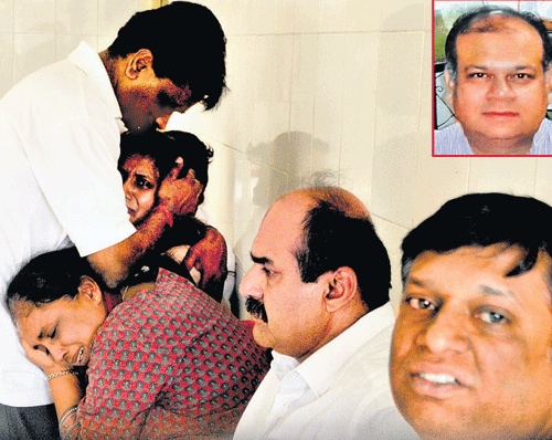 Family members and relatives mourn the death of K M Ananth Kumar (inset) who was found dead at Avalahalli lake in the City on Tuesday. DH photo
