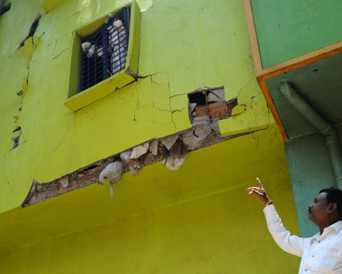The damaged portion of the house after a cylinder blast at Netajinagar in KP Agrahara.. DH Photo