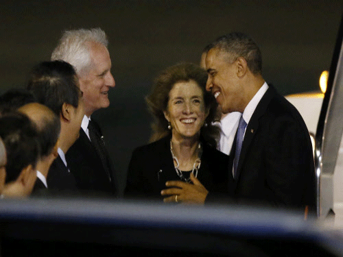 U.S. President Barack Obama greets U.S. Ambassador to Japan Caroline Kennedy (C), her husband Edwin Schlossberg (3rd R) and other officials upon his arrival at Haneda International Airport in Tokyo. Reuters Photo