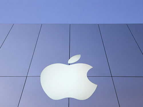 In a move to reward investors, tech giant Apple has approved an additional USD 30 billion share buyback by 2015 and declared a seven-for-one stock split on the back of strong iPhone sales that pushed its March quarter profit up 7 per cent. Reuters file photo
