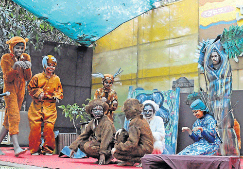 Students of Swaroopa Study Centre stage a play Kaade Koogu, to create environment awareness as a part of the literary meet on environment at Shediguri in Mangalore on Thursday. DH photo