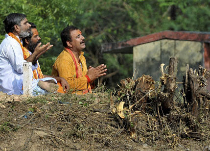 File photo of  local priests performing 'puja' at Raja Rao Rambux fort before ASI started excavation in search of hidden gold treasure in Unnao. PTI