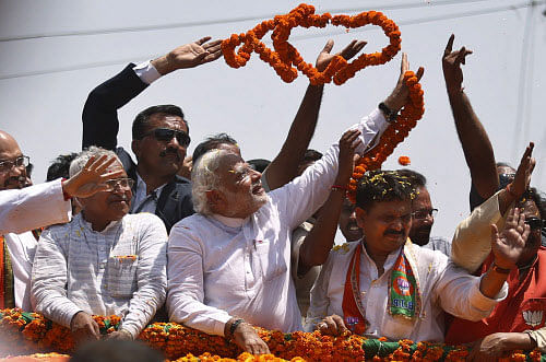 The Congress cried foul over the widely televised spectacle of Narendra Modi filing his nomination from Varanasi on Thursday.AP photo