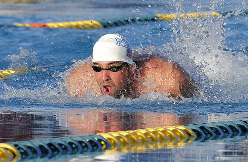 Michael Phelps competes in the 100-meter butterfly final during the Arena Grand Prix, Thursday, April 24, 2014, in Mesa, Ariz. Phelps was competing for the first time since the 2012 London Olympics. He finished second in the event. (AP Photo)