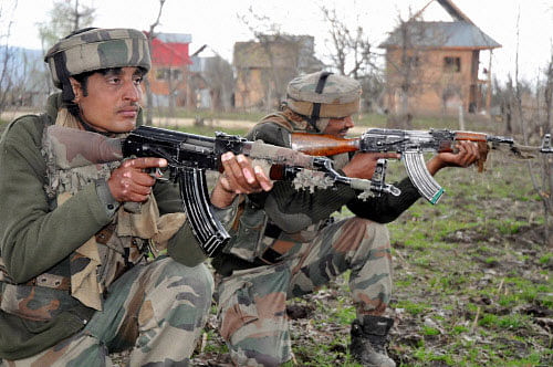 wo separatist guerrillas and a soldier were killed in a gunfight between security forces and guerrillas in Jammu and Kashmir's Shopian district Friday, police said. PTI photo