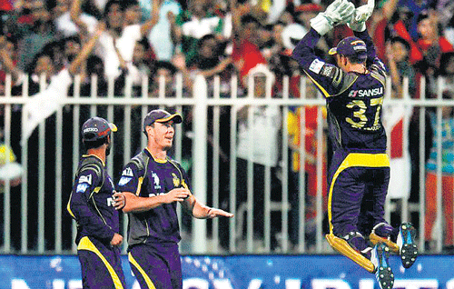 Chris Lynn (centre) was the toast of the Knight Riders' camp after taking an extraordinary catch to dismiss Royal Challengers' AB de Villiers. BCCI