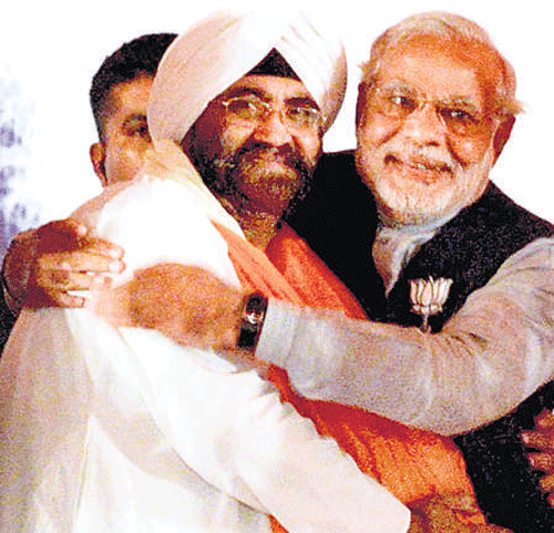 Modi with Daljeet Singh Kohli. PTI
