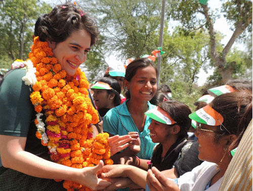 : Priyanka Vadra interacts with girl students during an election campaign for her mother and Congress President Sonia Gandhi in Raebareli . PTI Image