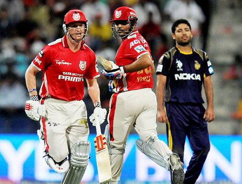 Virender Sehwag of the Kings X1 Punjab and George Bailey captain of the Kings X1 Punjab run between the wickets against Kolkata Knight Riders during the IPL7 match at the Sheikh Zayed Stadium, Abu Dhabi, United Arab Emirates on Saturday. Kings XI Punjab defeated Kolkata Knight Riders by 23 runs. PTI Photo