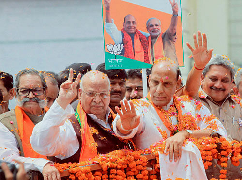 BJP President and Lucknow lok sabha seat candidate Rajnath Singh during roadshow in Lucknow on Sunday.PTI Photo