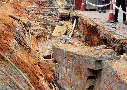 The trench where a mud wall collapsed on two workers on Cunningham Road on Sunday. DH Photo