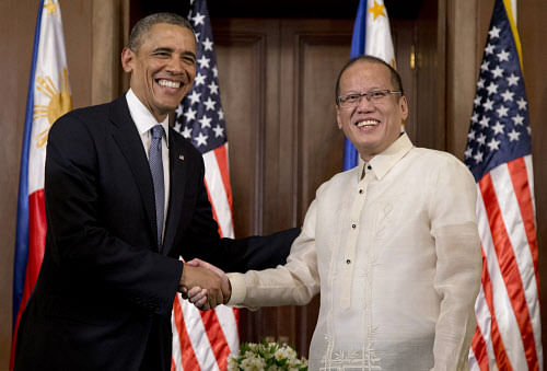 U.S. President Barack Obama and Philippine President Benigno Aquino III shake hands as they arrive to participate in a bilateral meeting at Malacanang Palace in Manila, the Philippines, Monday, April 28, 2014. Obama said a 10-year agreement signed Monday to give the U.S military greater access to Philippine bases will help promote regional security, improve armed forces training and shorten response times to humanitarian crises, including natural disasters. AP Photo