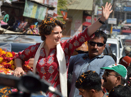 Priyanka Vadra waves during an election campaign for her mother and Congress President Sonia Gandhi in Raebareli on Monday. PTI Photo