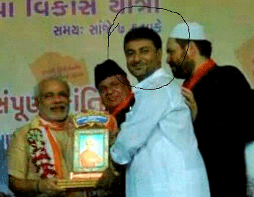 A photo released by the Congress shows Narendra Modi with Afroz Fatta who, it alleged, is a hawala operator. PTI