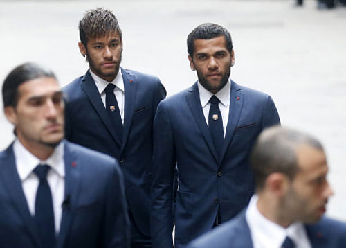 Coming out in support of Alves, club team-mate and compatriot Neymar posted a photograph of himself on Instagram holding a banana while writing We are all monkeys. Reuters file photo