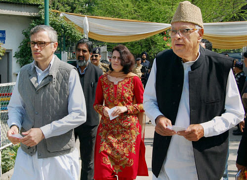 National Conference candidate Farooq Abdullah with his son and J&K Chief Minister Omar Abdullah and daughter Suraiya walks to cast votes for Lok Sabha elections in Srinagar on Wednesday. PTI Photo