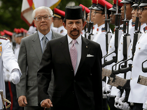 The sultan of oil-rich Brunei announced that tough Islamic criminal punishments would be introduced tomorrow, pushing ahead with plans that have sparked rare domestic criticism of the fabulously wealthy ruler and international condemnation. AP file photo