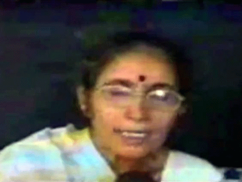 Jashodaben reached a village school to cast her vote accompanied by some of her relatives.    However, she avoided speaking to the media and left hurriedly after casting vote. TV grab