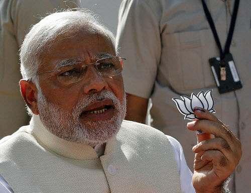 In an embarrassment for Narendra Modi, the BJP Prime Ministerial candidate faced EC's action for displaying party's election symbol 'Lotus' and making a speech after casting his vote in Gandhinagar.