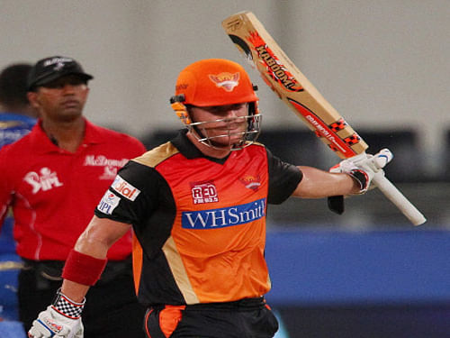 David Warner of the Sunrisers Hyderabad celebrates his fifty during an ipl 7 match against Mumbai Indians in Dubai on Wednesday. PTI Photo