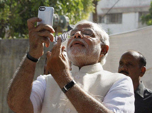 Modi's tweet where he has posted a selfie showing his inked finger and his party's symbol lotus were retweeted over 2,800 times. PTI photo