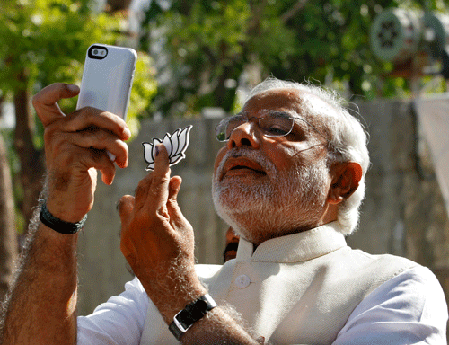 A selfie showing the lotus symbol by BJP&#8200;prime ministerial candidate Narendra Modi, soon after he cast his vote at a polling station in Gandhinagar, on Wednesday invited the ire of the Election Commission. Reuters