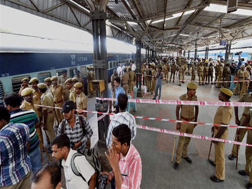 Security personnel at a railway platform where a train was ripped by two blasts at the railway station in Chennai on Thursday. PTI Photo