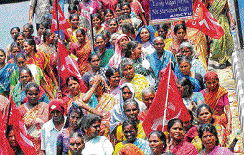 WORKERS OF THE WORLD UNITE: AICCTU activists take out a rally in Bangalore on May Day. dh Photo